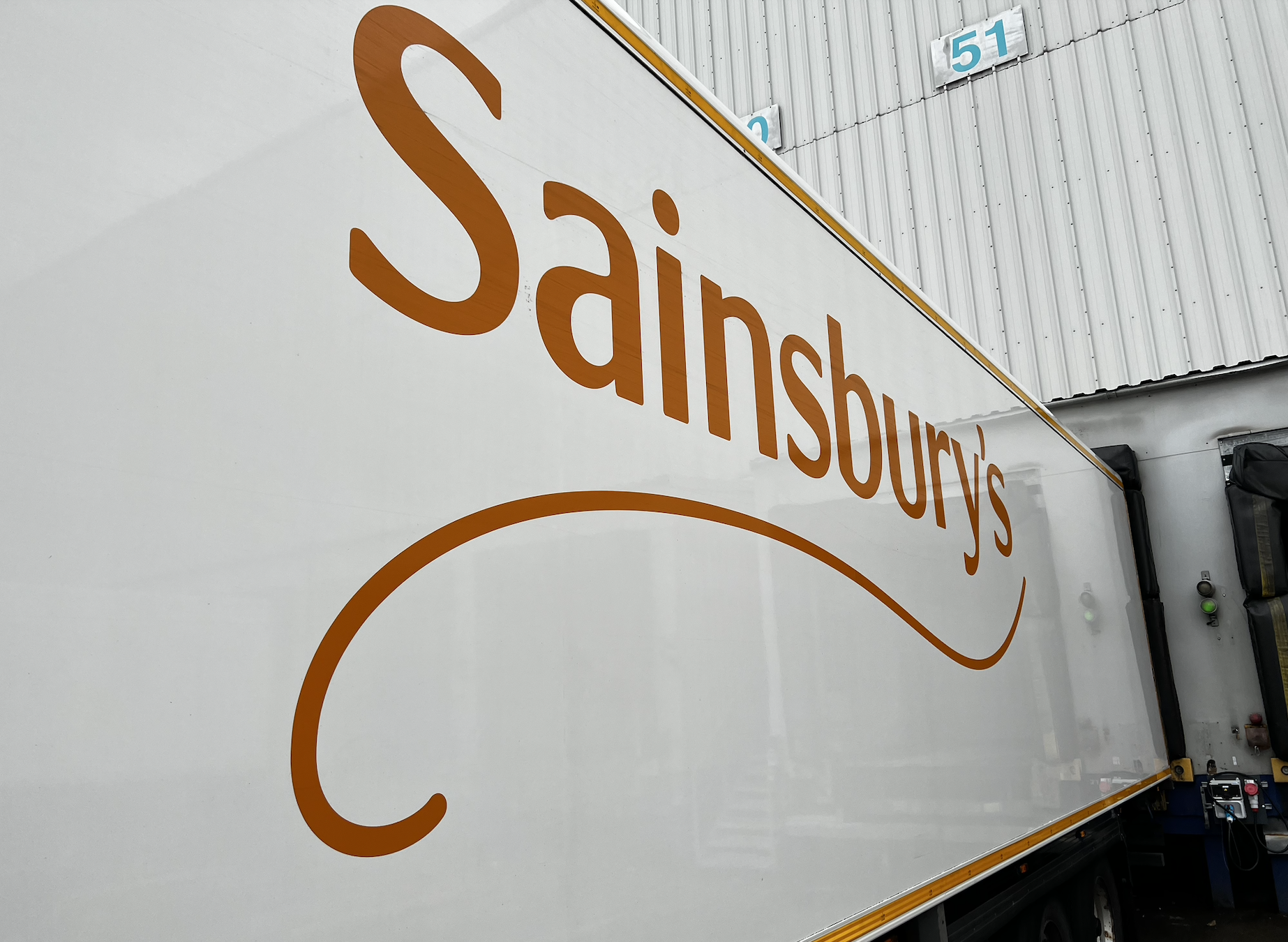 Sainsbury’s trailer at a distribution centre loading dock